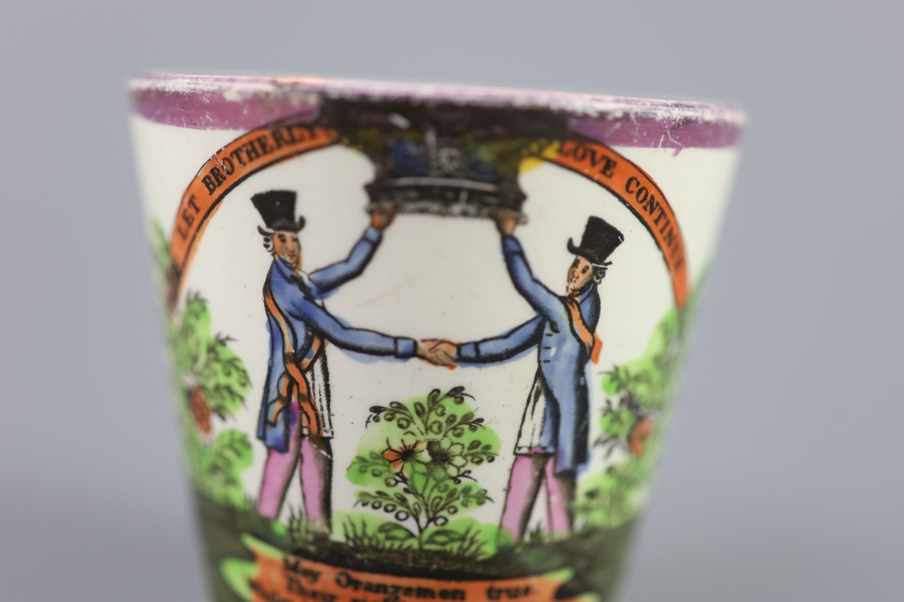 A rare pearlware Orangemen pink lustre beaker, c.1830, 7cm high